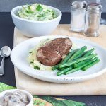 Steak with Creamy Mushroom Sauce - the ultimate dinner! Tender greens and creamy mash combine with a perfectly cooked steak and melt-in-your-mouth mushroom sauce.