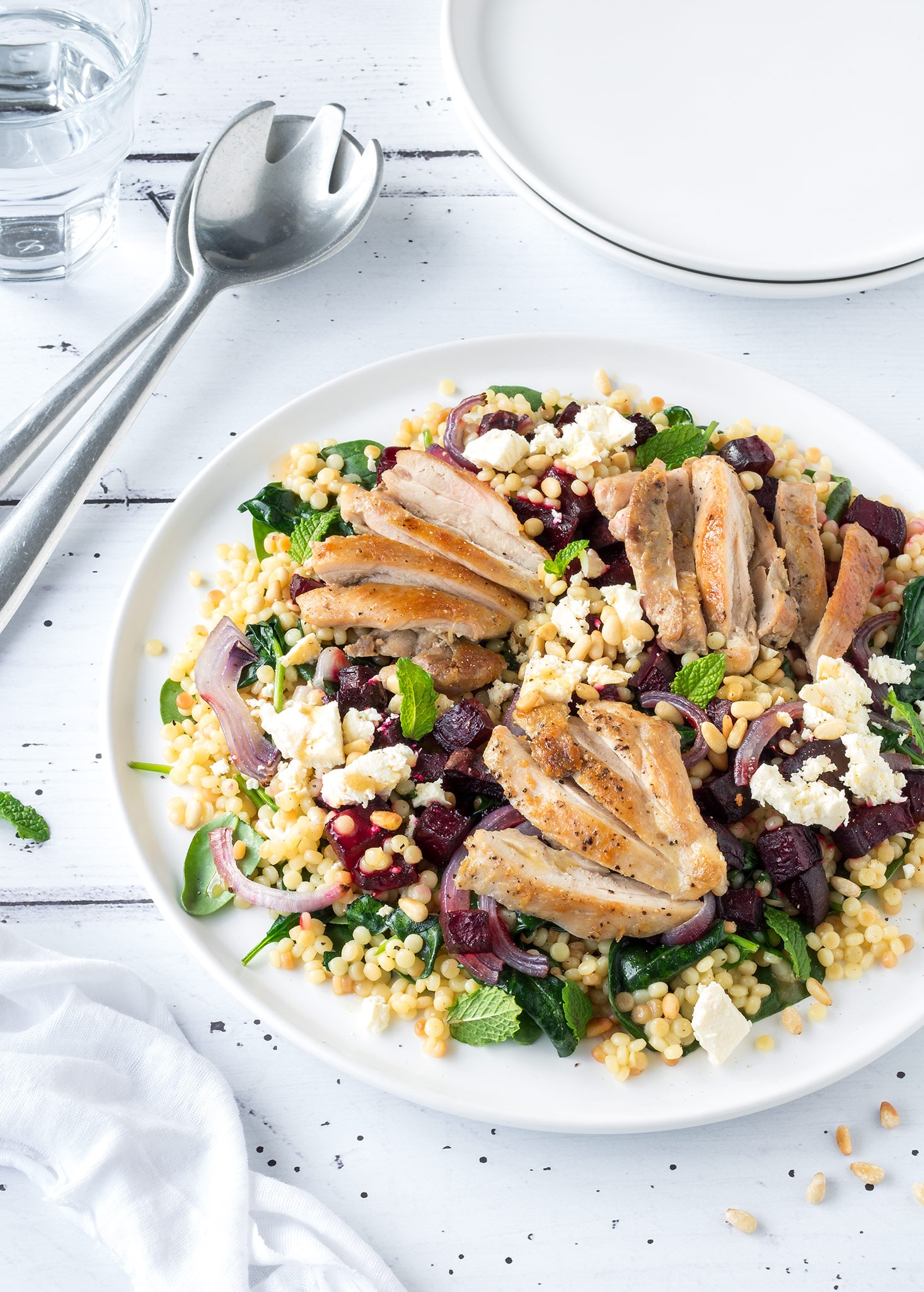 Plate of chicken, roasted beetroot and feta salad.