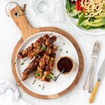 Summery chicken kebabs with corn on the cob and salad.