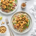 Vegetarian noodle salad with crispy tofu, peanut dressing and cashews.