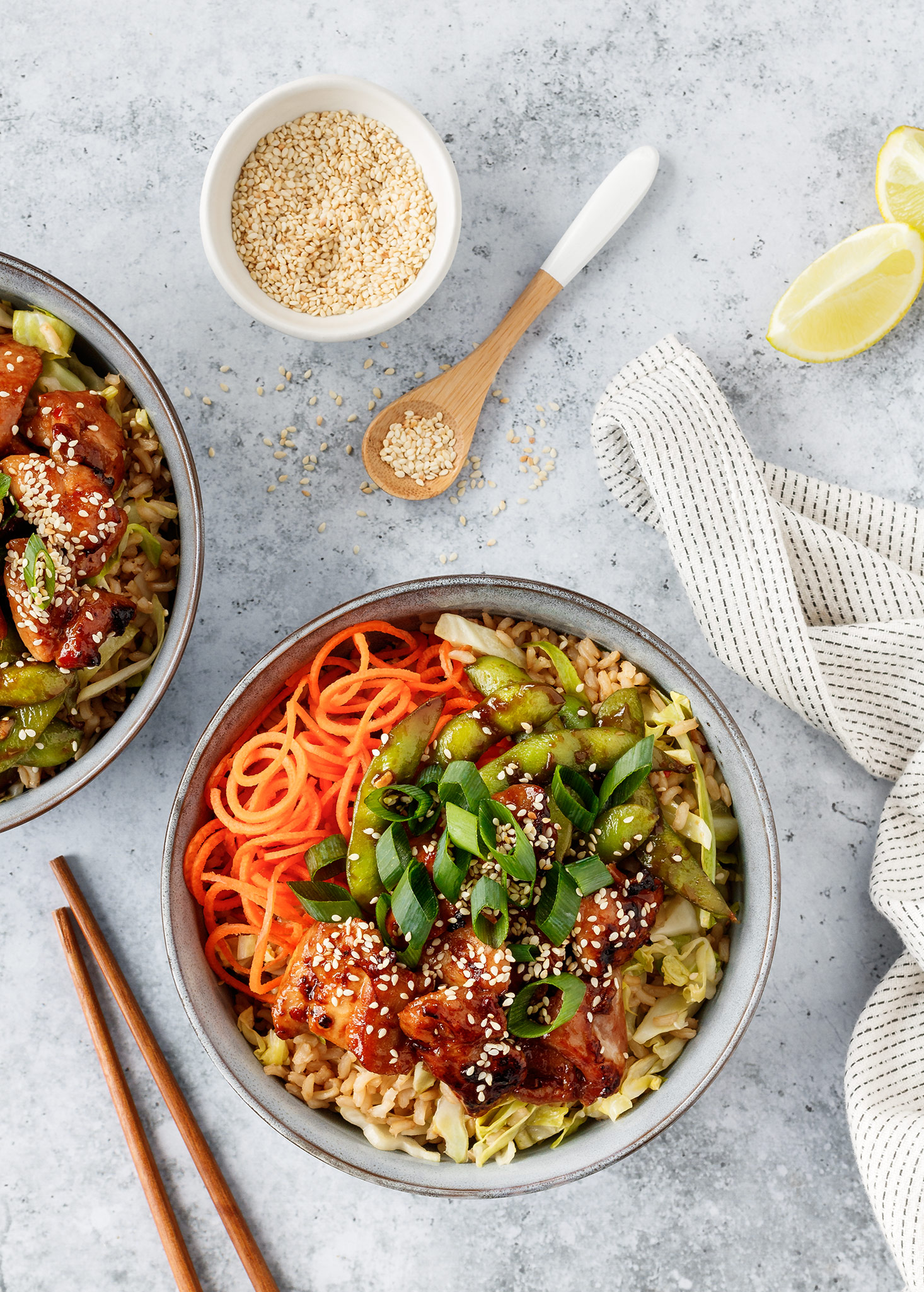 Sweet chilli chicken bowls with sticky edamame beans, rice and cabbage.