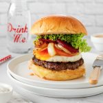 Kiwi burger with brioche bun, juicy beef patty, cheese, fried egg, onions, beetroot, tomato, lettuce and burger sauce.