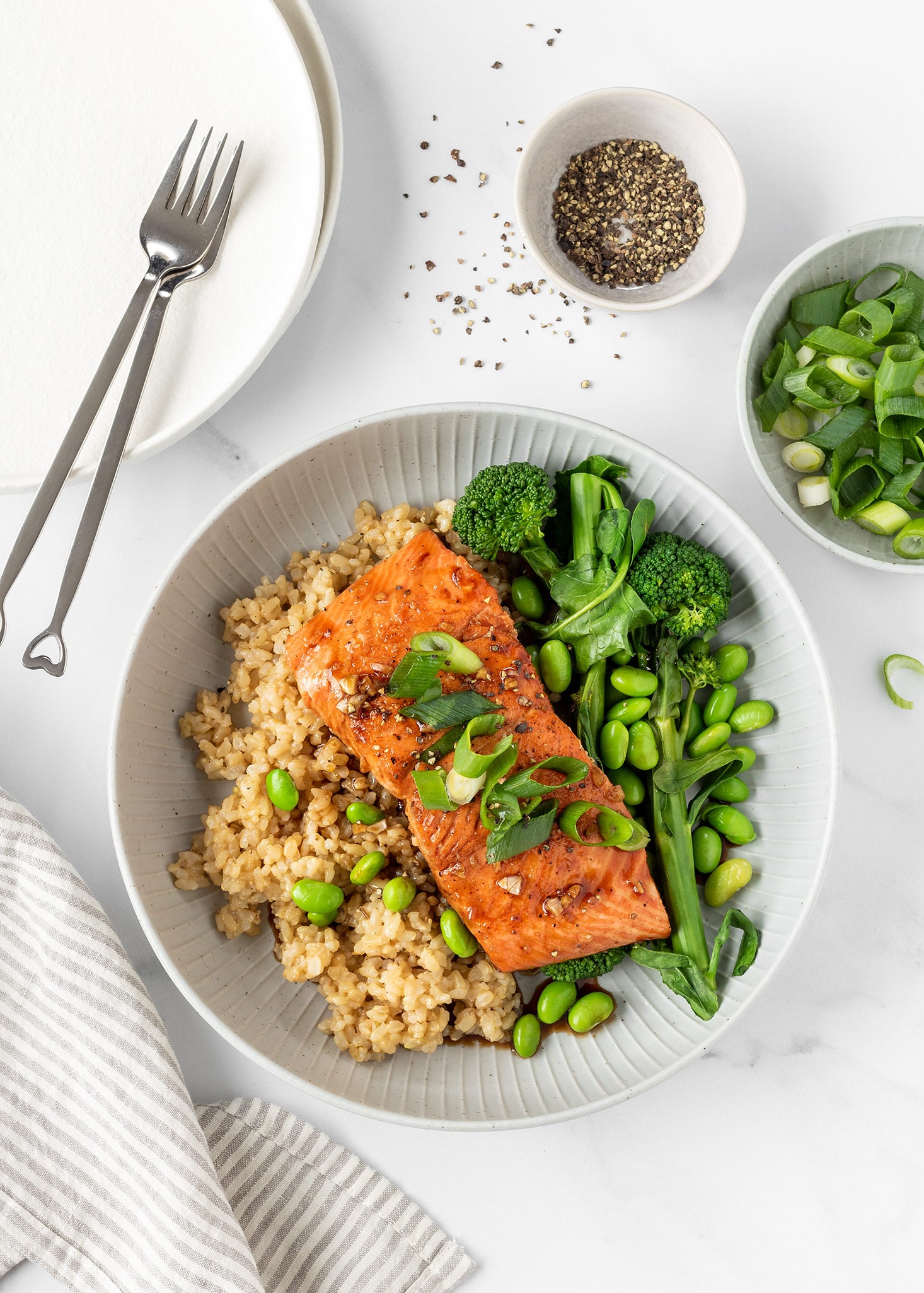 Honey garlic salmon with brown rice, broccolini and edamame.