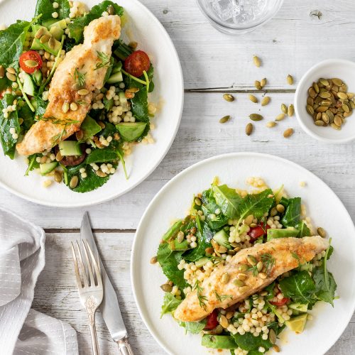 Pan fried fish on Israeli couscous salad with pumpkin seeds.