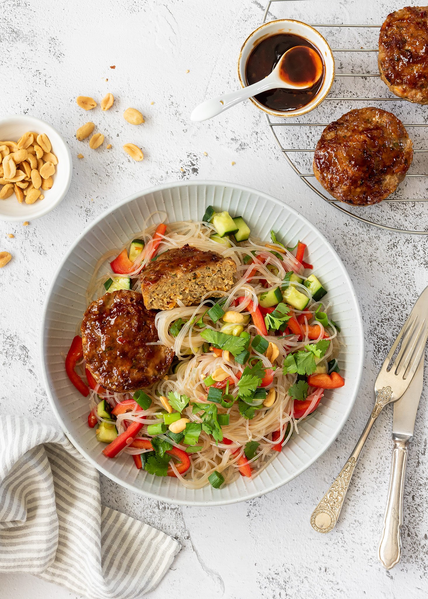Asian pork meatloaf with vermicelli noodle salad and roasted peanuts.