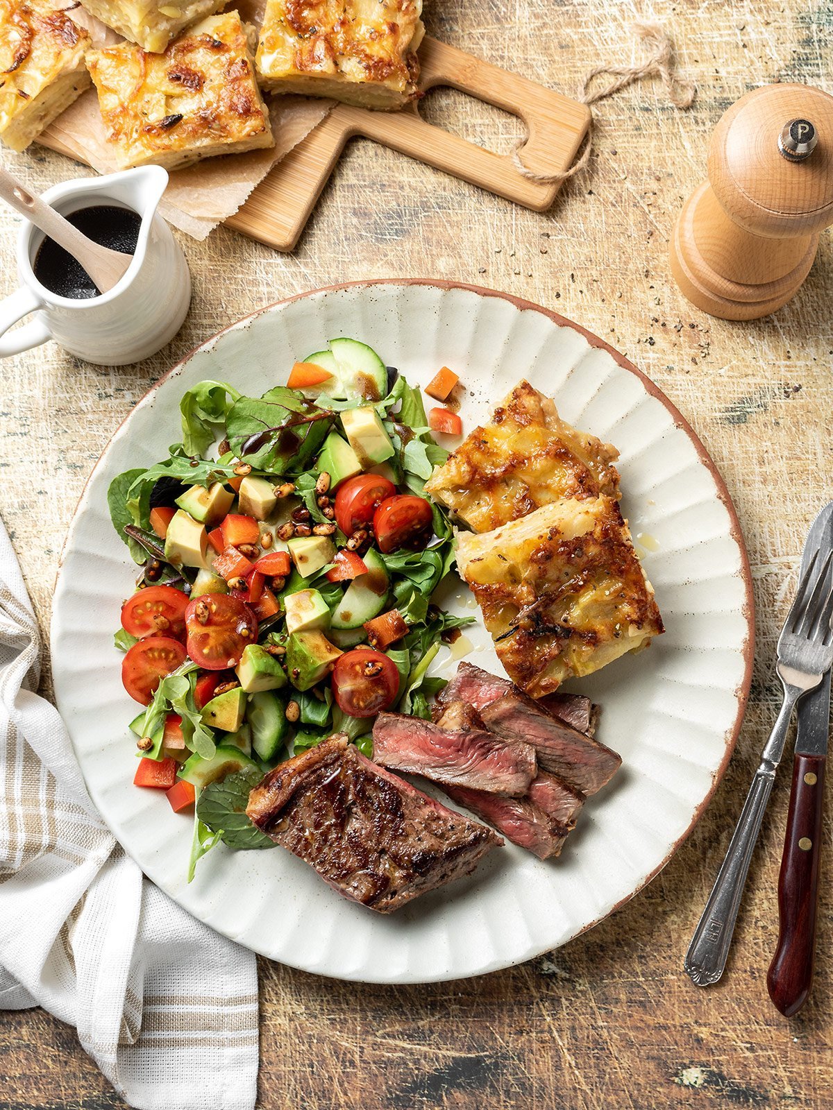 French onion potato bake with steak and salad.